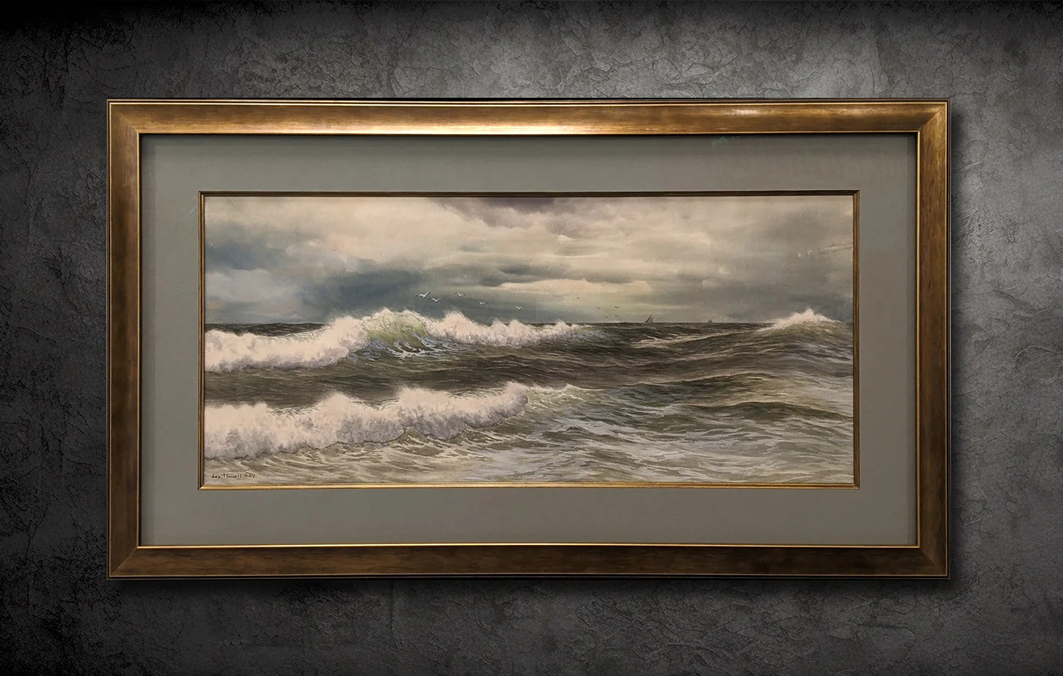 A framed painting of a turbulent ocean with waves crashing and a cloudy sky. Birds fly above the water, and a couple of distant boats are visible on the horizon.