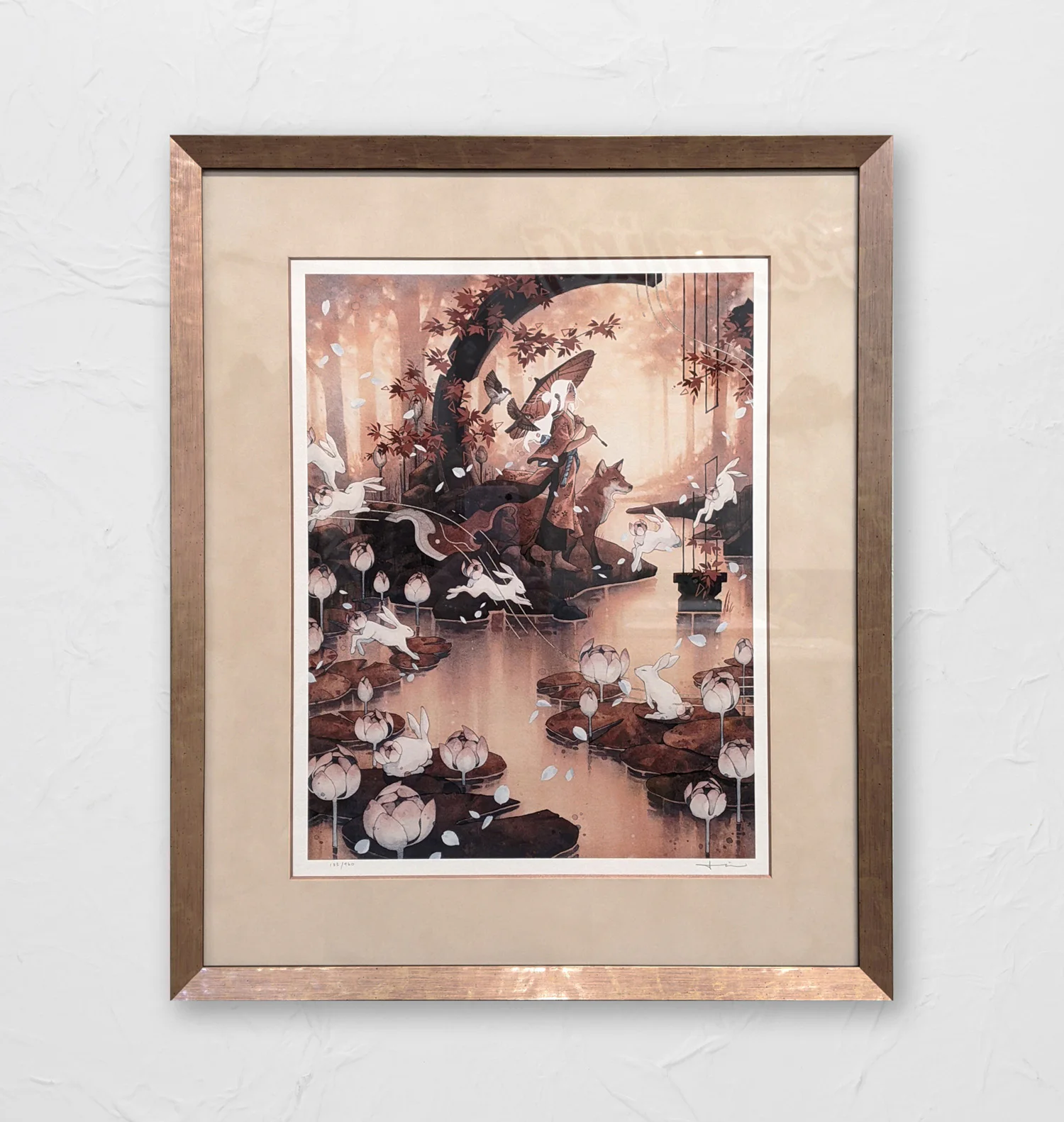 Framed artwork of rabbits and water lilies in a dreamy forest setting. It features muted colors, gentle lighting, and a serene atmosphere. The print is captured within a bronze frame.