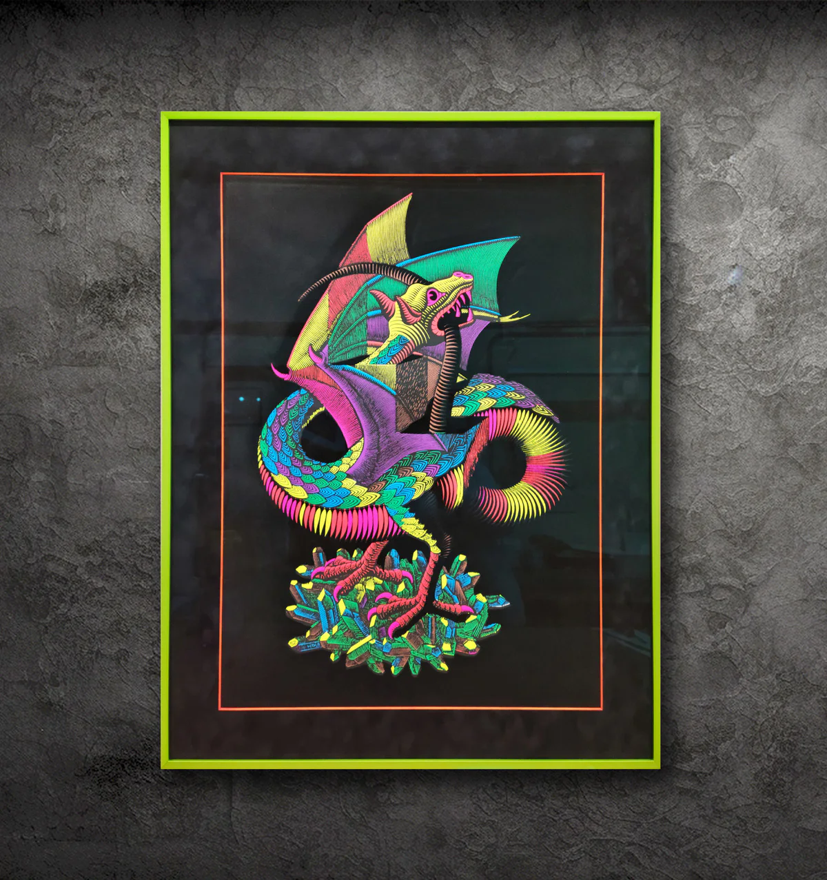 A framed painting of a colorful dragon with vibrant scales and bat-like wings, standing on a cluster of crystals. The frame is green with a black background. The wall is textured grey.