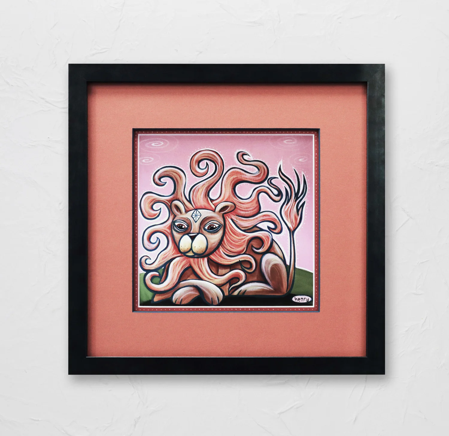 A framed surreal painting of a lion with wavy, flowing mane and abstract features, set against a pink background, encased in a black frame with a coral mat.