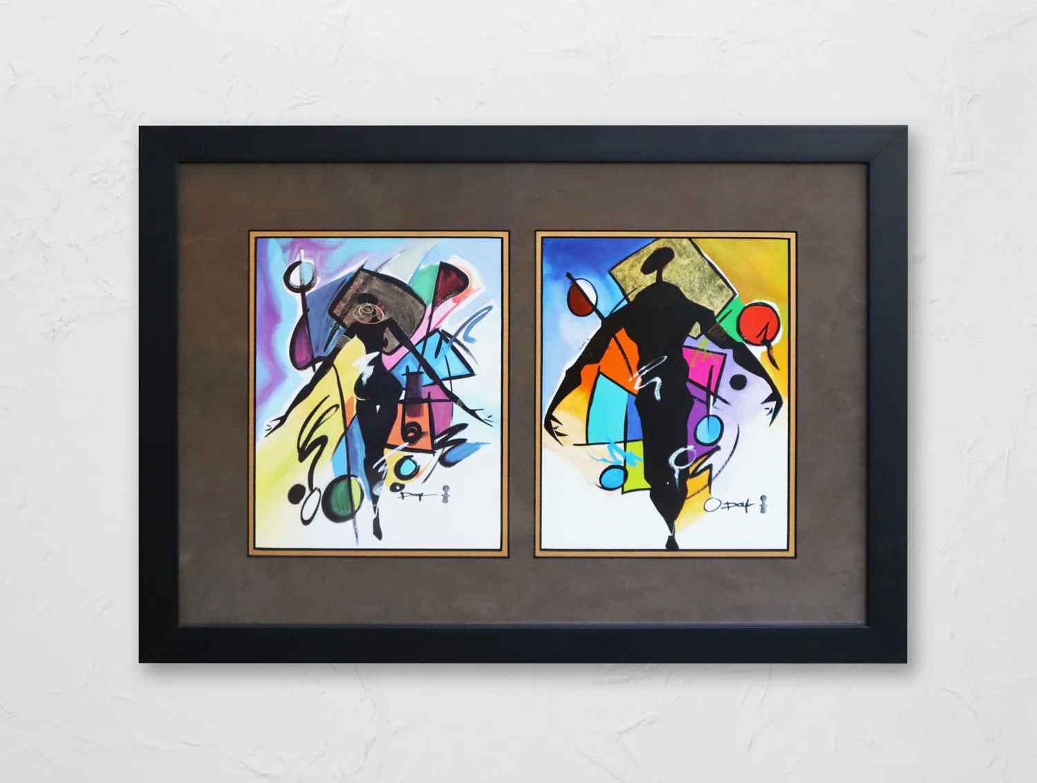 A framed artwork with two abstract paintings, each featuring vibrant colors, geometric shapes, and dynamic black silhouettes. The background is a textured white wall.