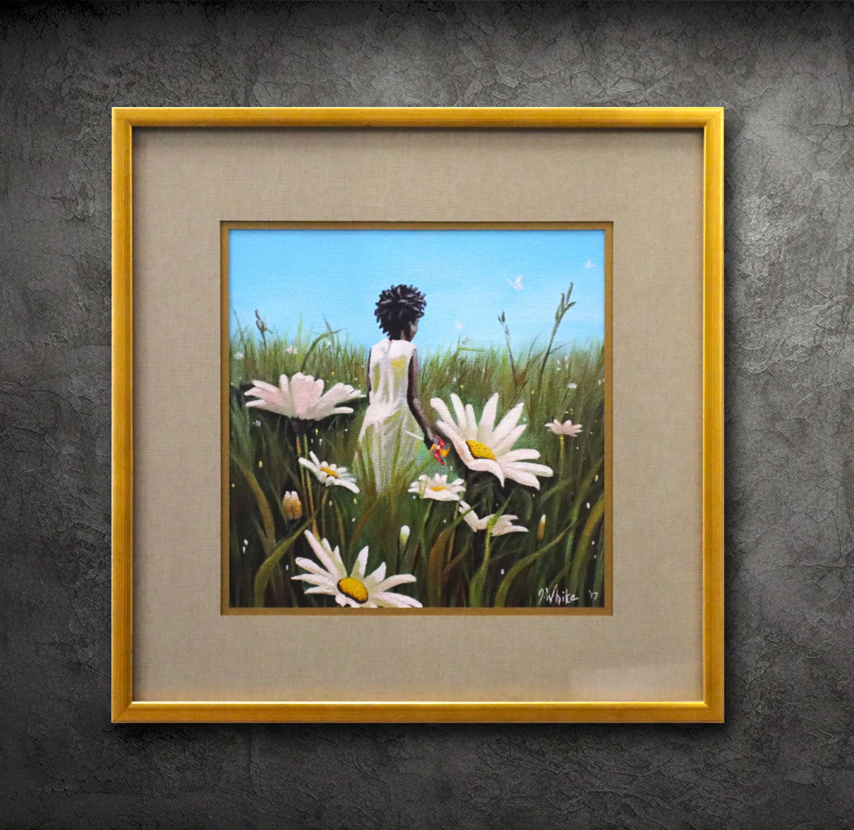 A framed painting depicts a person in a white dress standing in a field of large daisies with a butterfly on their hand, set against a blue sky. The frame has a beige mat and golden border.