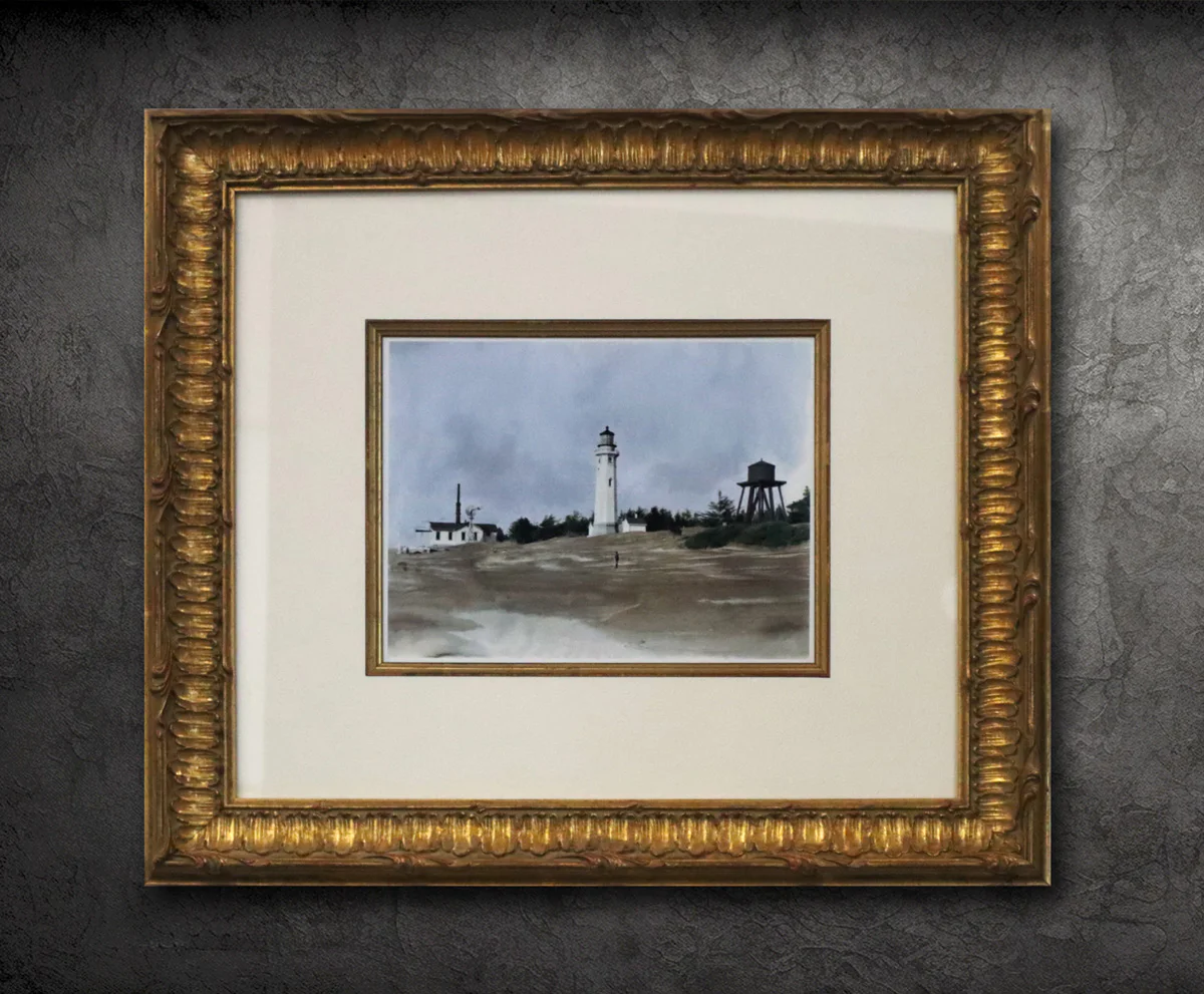 Framed painting of a beach with a lighthouse, trees, water tower, and a small house, against a textured grey wall. The ornate gold frame has intricate detailing.