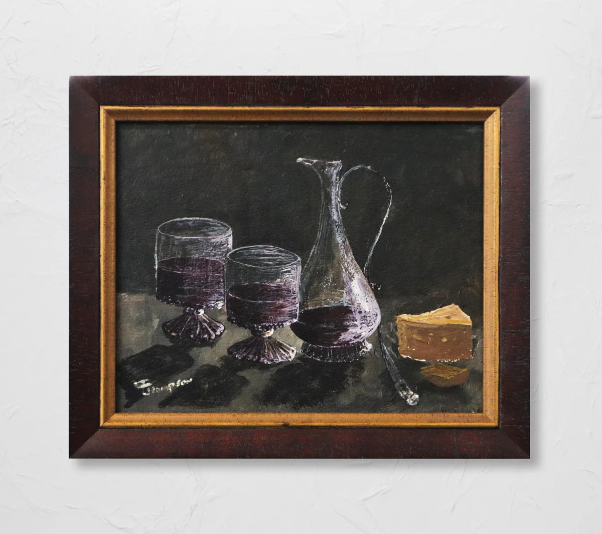 Framed painting depicting two wine glasses and a decanter filled with red wine alongside a piece of cheese on a dark background.
