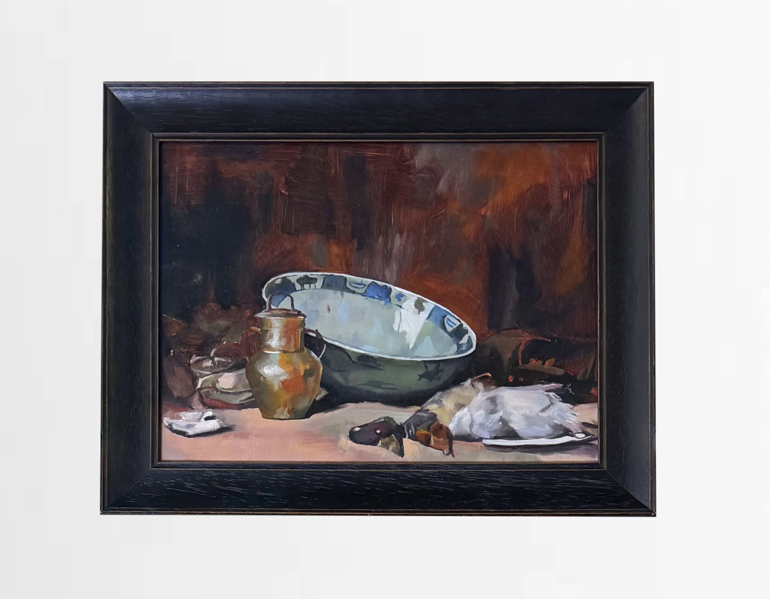 Framed still life painting featuring a jug, a large blue and white ceramic bowl, and a white cloth on a table with a dark, textured background.