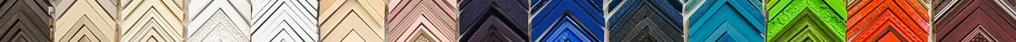 Various colored and textured picture frames are arranged in a vertical, chevron pattern, showcasing a range of neutrals, blues, greens, oranges, and browns.